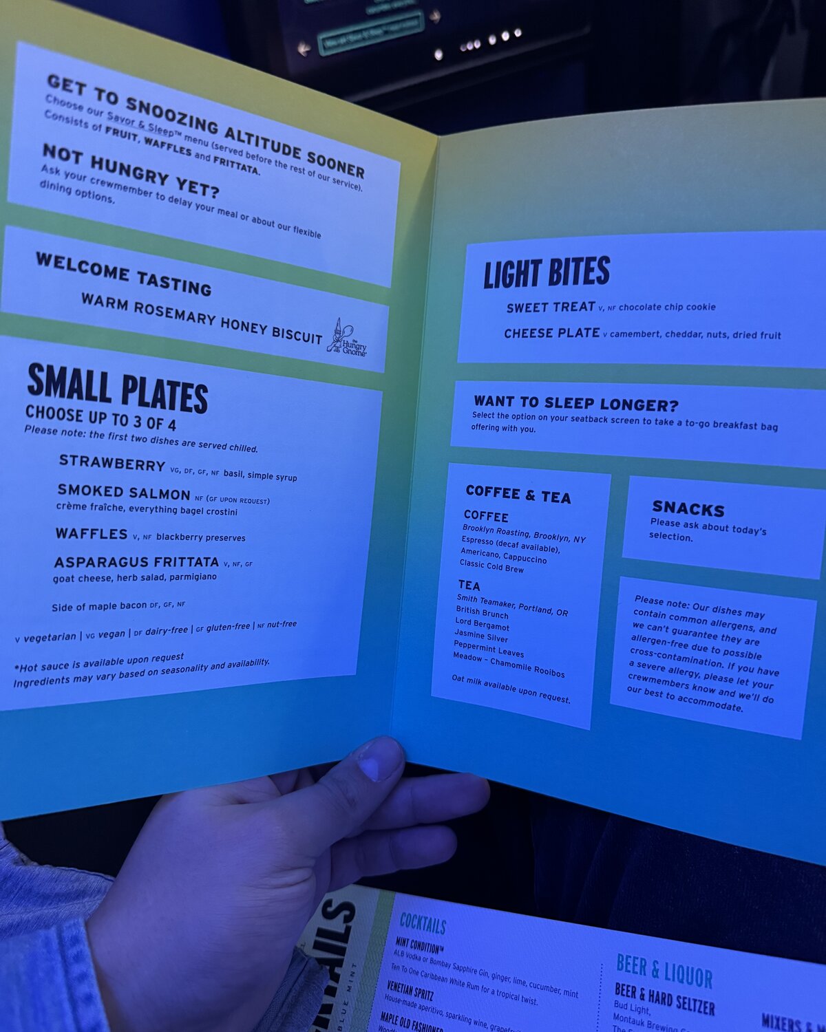 Open JetBlue Mint small-plates menu showing the choose-up-to-three dishes format, light bites, and coffee and tea options